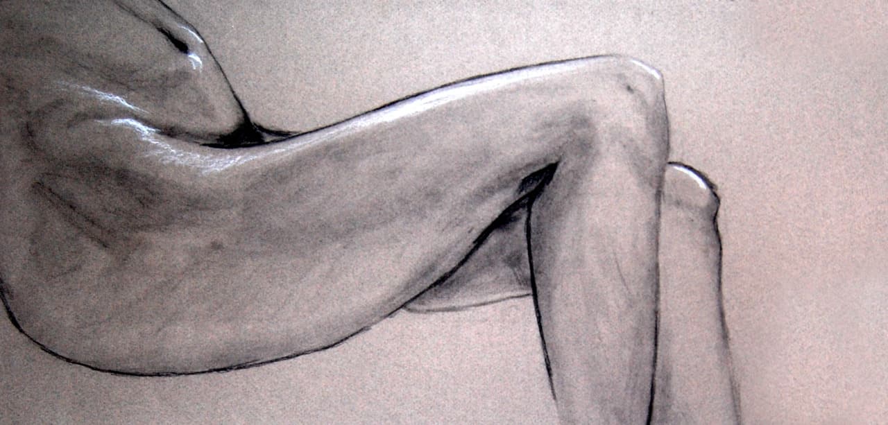 Charcoal figure study focused on bent legs